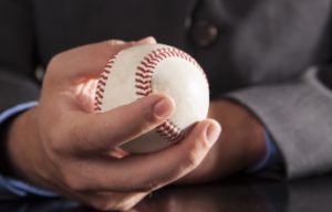 hand holding a baseball
