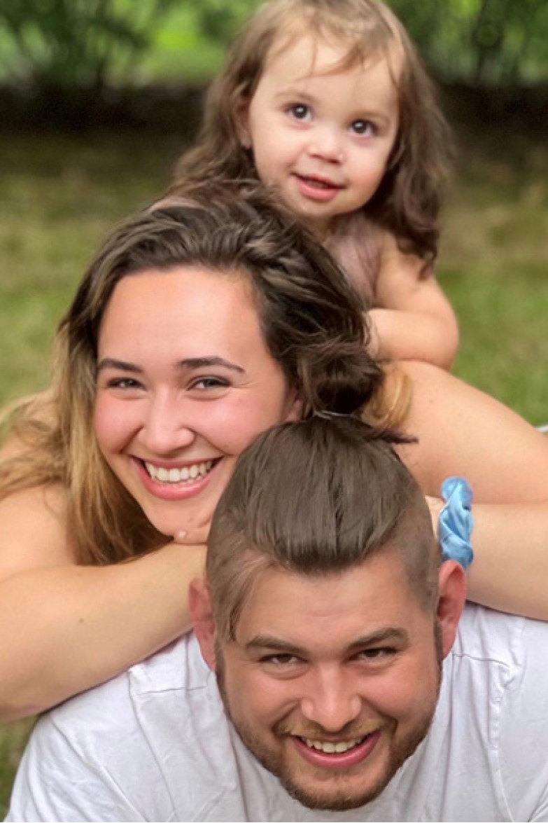 Family photo of Skyler Pinto with her husband and child